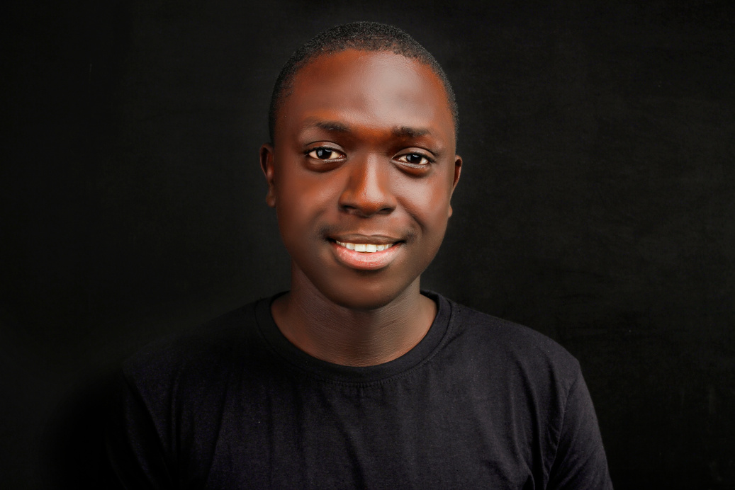 Close-Up Shot of a Man in Black Shirt Smiling