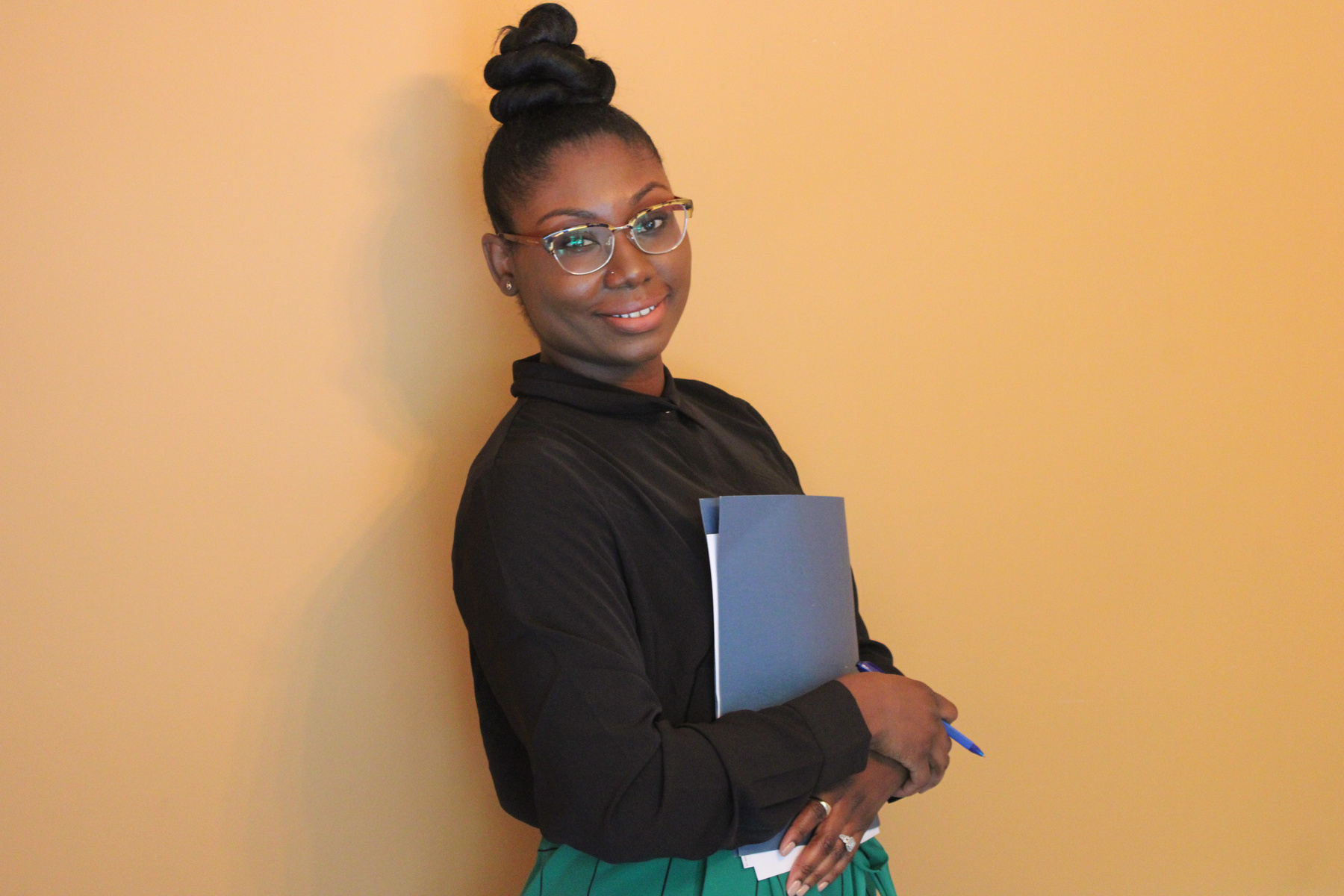 Professional Woman Holding a Folder 