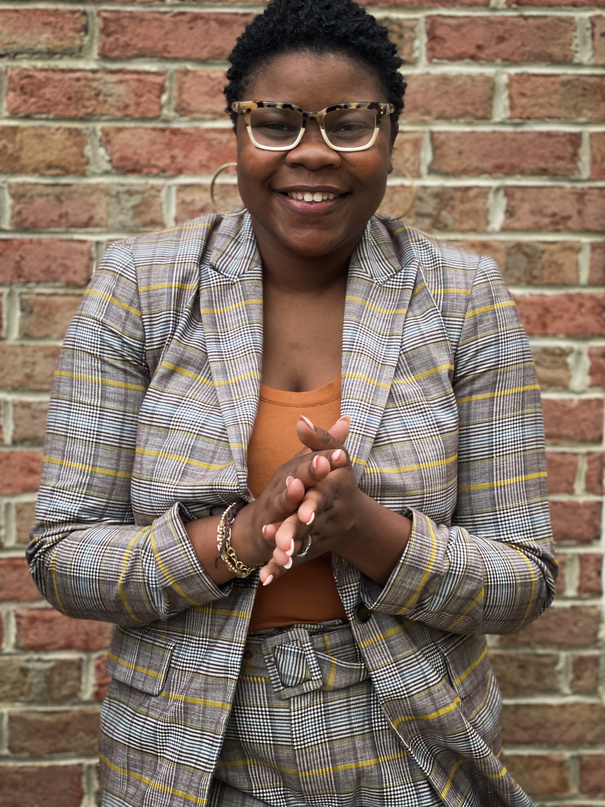 Happy Woman in Formal Clothes on Brick Wall Background 